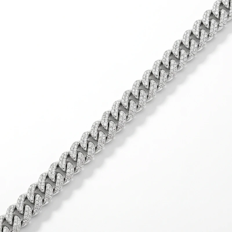 White-gold diamond pavé cuban curb link chain necklace on pure white.